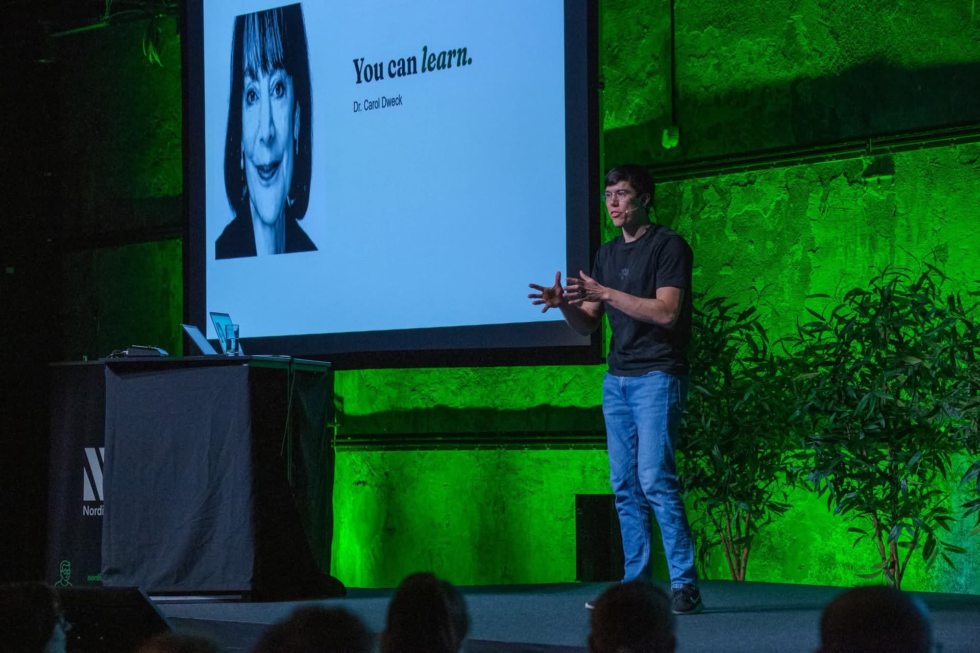 Jonas Hulthén delivering a growth mindset keynote on stage